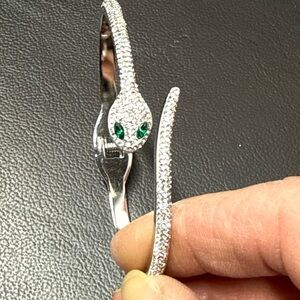 Elegant Silver Snake Bracelet with Green Accents
